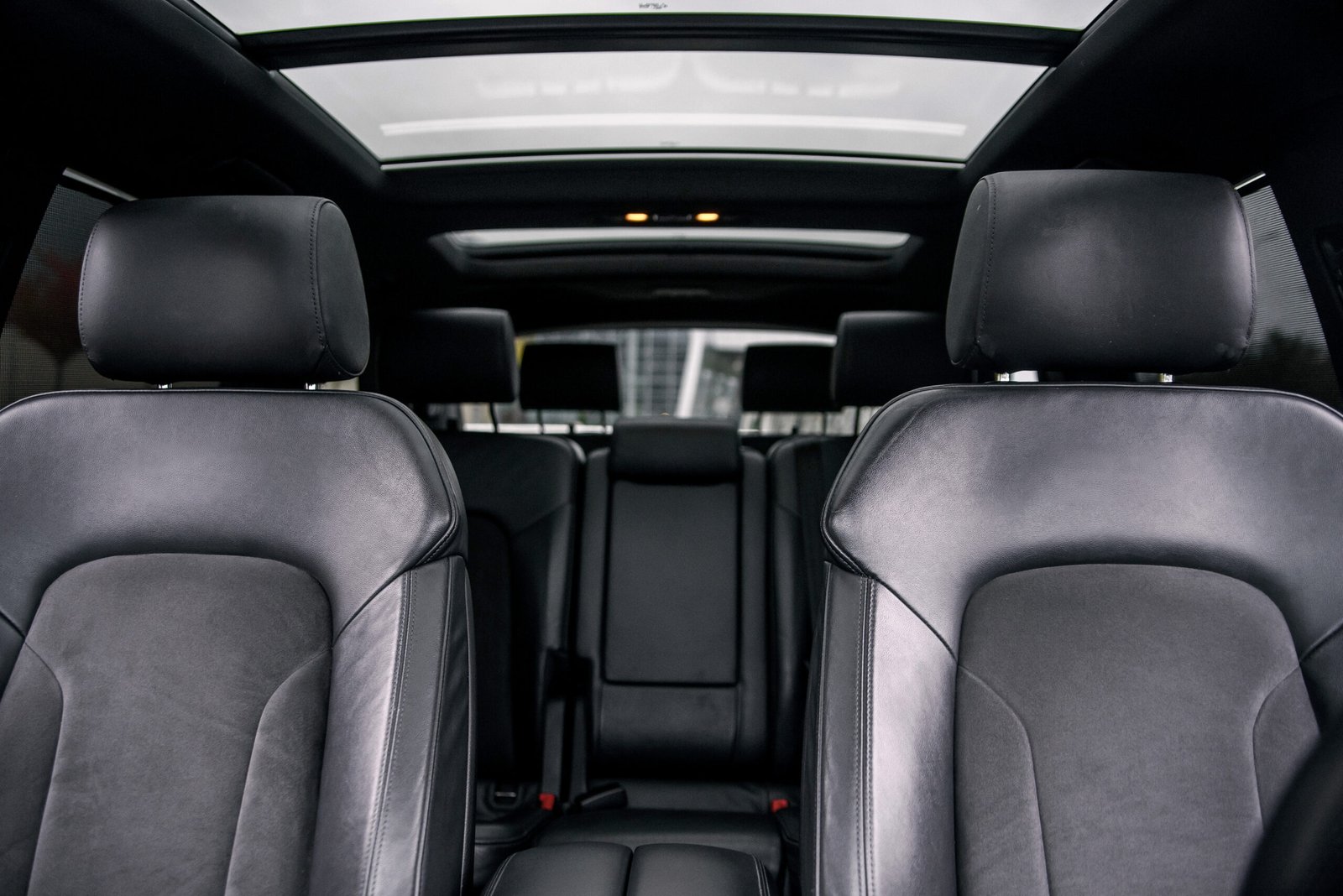 Luxury SUV black leather seats with panoramic sunroof and third-row seating