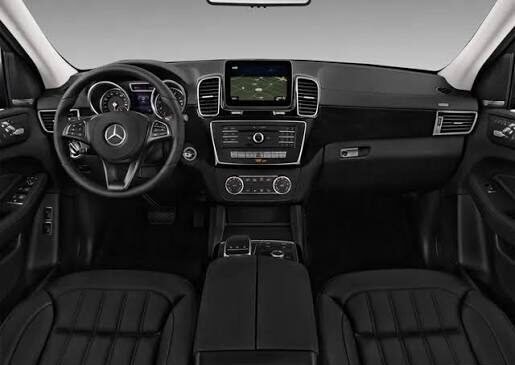 Mercedes-Benz GLE interior dashboard with black leather seats and touchscreen infotainment system