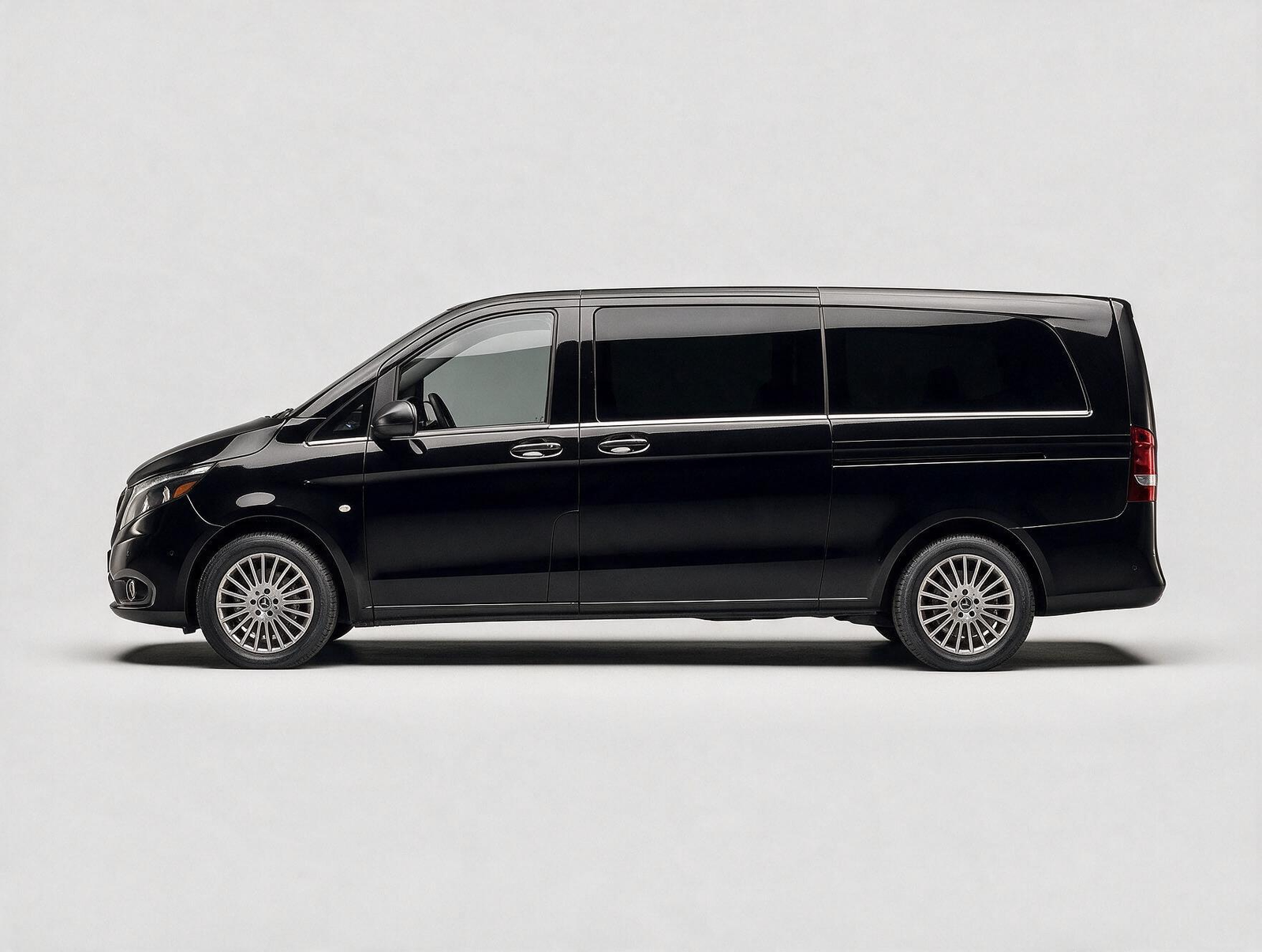 Black Mercedes-Benz V-Class luxury passenger van side profile on white background