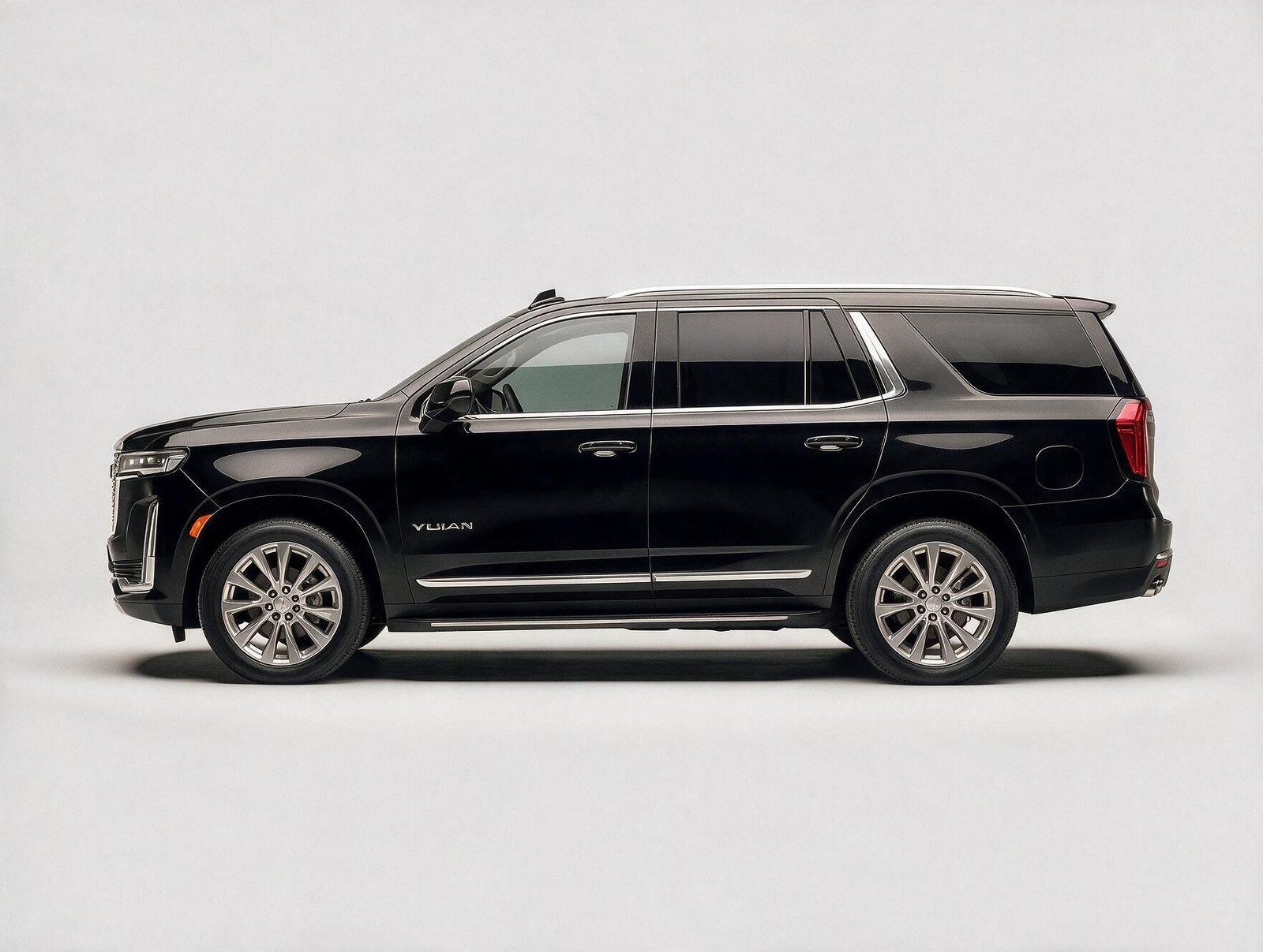 Black GMC Yukon Denali full-size luxury SUV side profile on white background