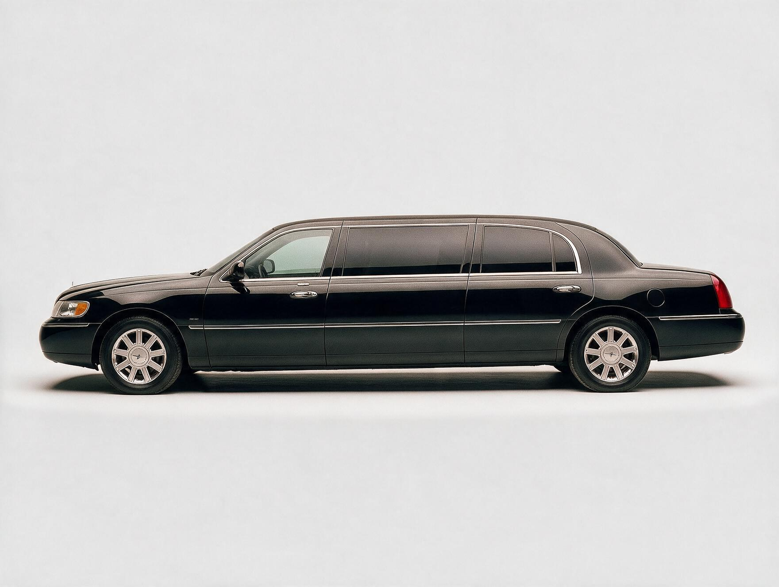 Black stretch limousine side profile on white background